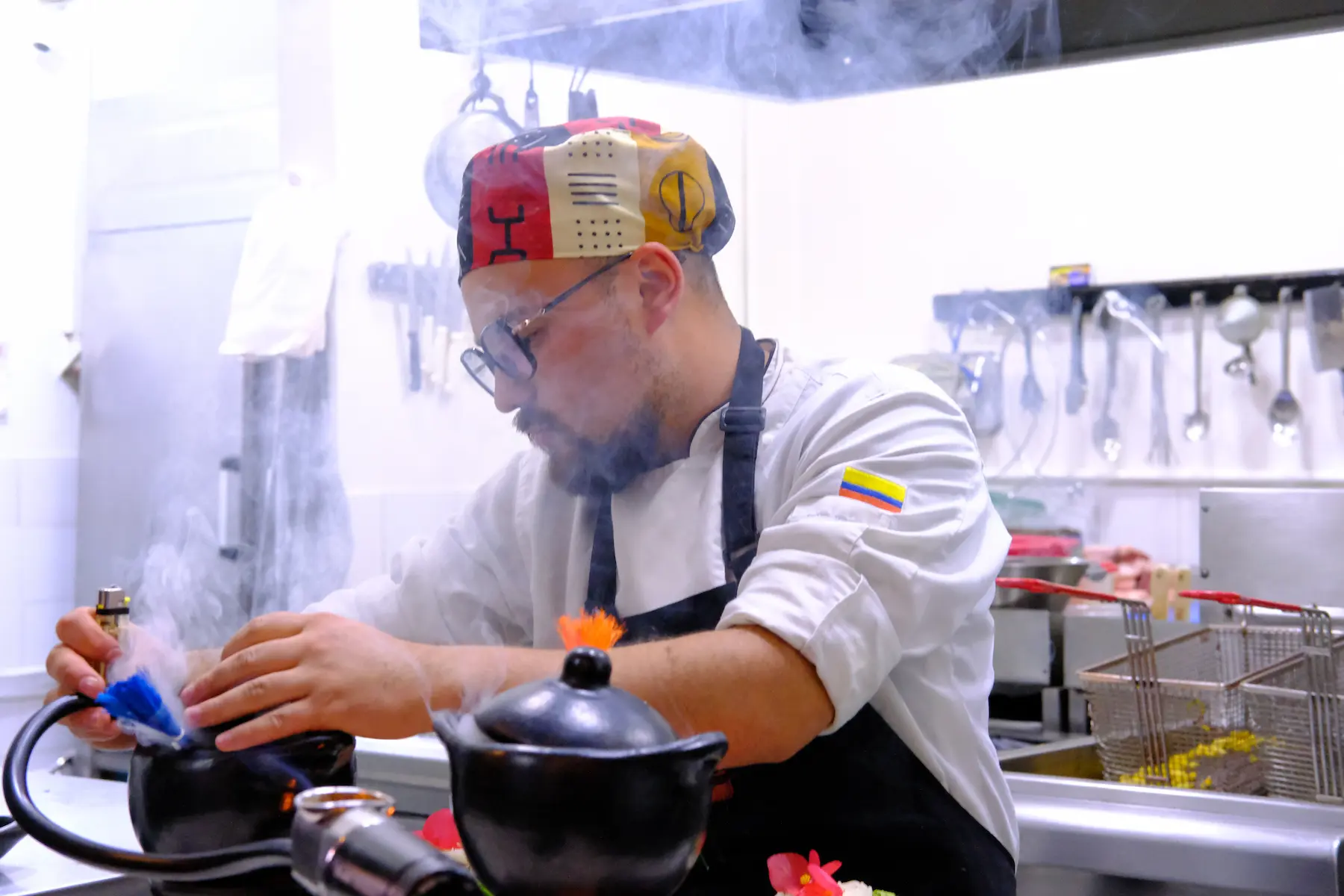 Chef preparing traditional Ajiaco soup during a cooking class in Bogotá